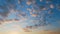 Blue sky with clouds. Puffy fluffy beautiful orange and peach clouds on blue sky. Time lapse.