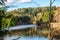 blue sky and clouds reflecting in calm water of river Gauja in latvia in autumn