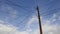 Blue sky and clouds with telephone pole