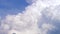 Blue sky with clouds timelapse. White big cloud on blue sky. a big and fluffy cumulonimbus cloud in the blue sky. Edge