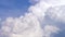 Blue sky with clouds timelapse. White big cloud on blue sky. a big and fluffy cumulonimbus cloud in the blue sky. Edge