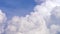 Blue sky with clouds timelapse. White big cloud on blue sky. a big and fluffy cumulonimbus cloud in the blue sky. Edge