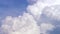 Blue sky with clouds timelapse. White big cloud on blue sky. a big and fluffy cumulonimbus cloud in the blue sky. Edge