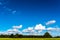Blue sky, clouds, trees and grass near Bath