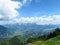 Blue sky with clouds, valley with lake in foreground