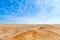 Blue sky with clouds and yellow sands of Paracas desert national