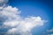 Blue sky cloudscape fluffy atmosphere air high environment clouds white puffy cumulous heavenly cloud formation