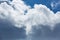 Blue sky covered in large puffy cumulonimbus cloud formations