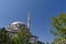 Blue sky domes and minarets, mosques in turkey, trees and minaret of a mosque