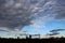 Blue Sky in evening with clouds. Big city buildings silhoutes panorama. City life concept