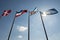 Blue sky with four flags