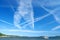 Blue sky full of airplane traces