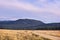 Blue sky. Green Forest. High mountains. Field