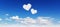 Blue sky with hearts shape clouds