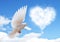 Blue sky with hearts shape clouds and dove.