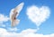 Blue sky with hearts shape clouds and dove.