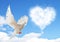 Blue sky with hearts shape clouds and dove.