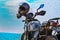 blue sky  and high speed bike,bike and helmet,Part of motorcycle  headlight. Detail of Motorbike