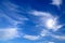 Blue sky landscape background. Picturesque beautiful cirrus clouds create unusual patterns in the sky. Cloudy weather in spring