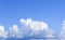 Blue sky with massive cumulus clouds