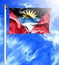 Blue sky and mast with hanged waving flag of Antigua and Barbuda