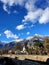 Blue sky with mountains shadow and buildings