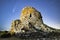 A blue sky with the Neowise comet and a Sardinian Nuraghe. High quality photo