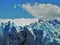 Blue sky over the large glacier with snow and ice