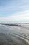 Blue sky over seagulls on a sandbar where the Santa Clara river enters the Pacific Ocean at Surfers Knoll in Ventura California