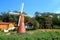 Blue sky with peacefull cotton clouds and European Garden