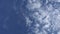 Blue sky and puffy clouds in day time. Round puffy clouds slowly move horizontal in clear day sky. Beautiful clouds, clean atmosph