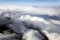 Blue sky and puffy clouds on height of 5000 m