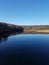 Blue sky reflected in the Huron River in Ann Arbor, Michigan