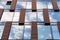 Blue sky reflected in mirror windows of modern office building