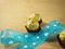 Blue sky ribbon with heart shape, chocolate balls, covered golden aluminium