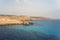 blue sky. sea rocks and rocks on beach of Aphrodite. Cyprus. Mediterranean sea