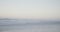 Blue sky and sea with waves on empty sunny beach