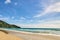 Blue sky. Sea waves. Green trees. Bright sand