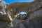 Blue sky shines through the holes and crevices of the Bisti sandstone