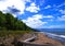 Blue sky and sloping beach