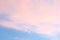 Blue sky soft pink clouds sunset