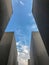 Blue sky between stone slabs that make up the Memorial to the Mu