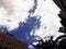 Blue sky with thick clouds and buildings around