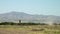 Blue sky tilting down to distant mountain ranges