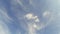 Blue sky with time lapse clouds.