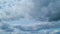 Blue sky in tropical summer or spring sunlight. Blue sky background with tiny cumulus cirrus on different layers clouds