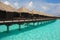 Blue sky turquoise water Getaway Island Holiday on Overwater Bungalow at a tropical resort island, Maldives