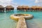 Blue sky turquoise water with round structure Long Awaited vacation on Overwater Bungalow at a tropical resort island, Maldives