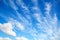 Blue sky with white altocumulus clouds layer
