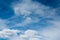 Blue sky with white cirrus clouds and cirrocumulus clouds and  cumulonimbus clouds